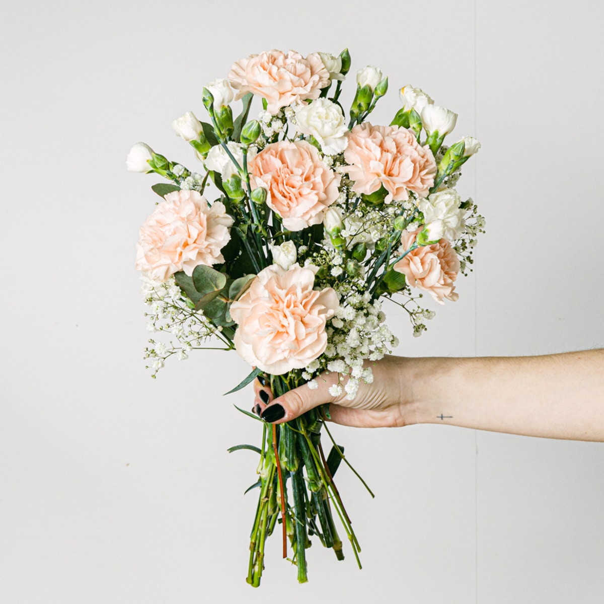 Pink carnations flower bouquet with vase